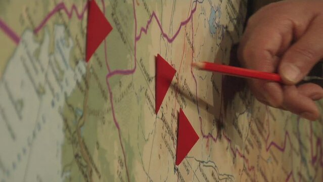 Person pointing to map
