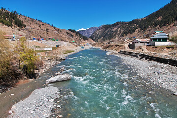 Fototapeta premium Swat river in the valley of Himalayas, Pakistan