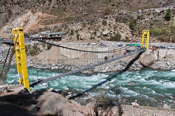 The bridge on Swat river in the valley of Himalayas, Pakistan © Sergey