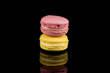 Colorful macaroon over black background