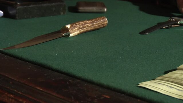 Vintage gun and knife on table, Moscow, Russia