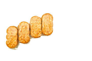 Delicious sweet cookies in a protective cellophane package for sale on a white