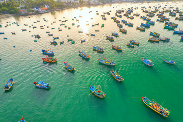 Aerial view of Mui Ne fishing village in the morning with hundreds of boats anchored to avoid storms, this is a beautiful bay in central Vietnam