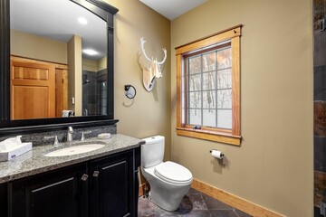 Bathroom of a contemporary rustic home in the mountains