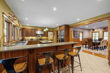 Beautiful contemporary rustic home interior living room design with a kitchen island