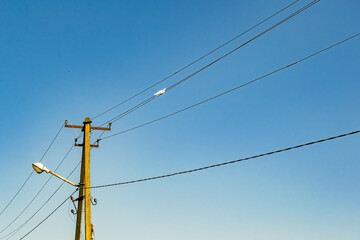 Power electric pole with line wire on colored background close up