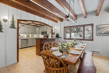 Modern kitchen with wooden table and rustic elements