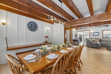 Modern kitchen interior with wooden table and rustic elements