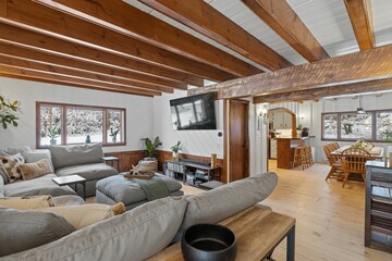 Modern living room with a comfortable couch and rustic elements