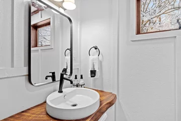 Foto op Aluminium Bathroom wit a wooden shelf below the mirror and a large mirror © Allan Wolf/Wirestock Creators