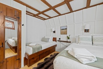 Comfortable simple bedroom with two twin beds side by side