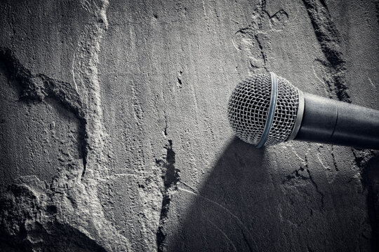 Microphone background on stone textured surface