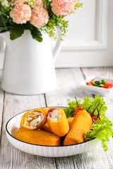 risoles or risolle pastries filled meat (ham), egg,cheese and mayonaise.. is a small patty rolled in breadcrumbs.