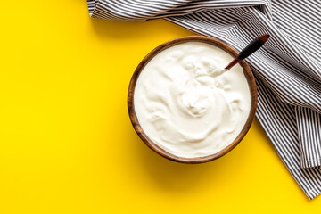 Bowl of sour cream or yogurt. Dairy product background