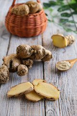 Ginger in basket on wooden table