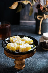 getuk or mashed cassava cake with dramatic lighting
