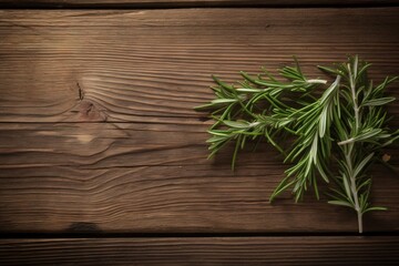  a sprig of rosemary on a wooden table top view from above with space for a text or a logo on the side of the image.  generative ai