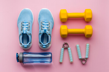 Gym and fitness equipment and workout tools with sneakers and dumbbells