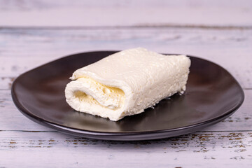 Clotted cream on wood background. Clotted cream (butter cream) for Turkish breakfast. local name inek kaymak