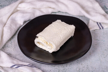 Clotted cream on gray background. Clotted cream (butter cream) for Turkish breakfast. local name inek kaymak