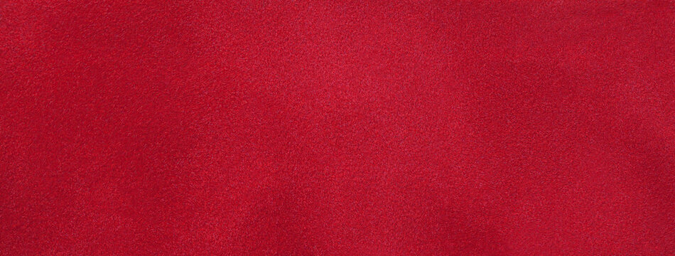 Texture of dark red velvet matte background, macro. Suede ruby fabric with pattern. Seamless wine textile