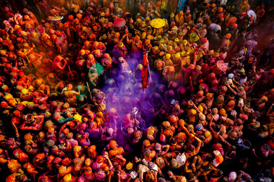 Nandgaon, India - 01 March 2023: Aerial view of people celebrating the holy colour festival at Shri And Baba Temple, Uttar Pradesh, India.
