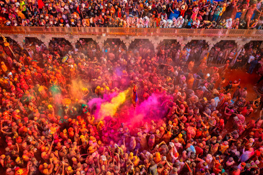 Nandgaon, India - 01 March 2023: Aerial view of people celebrating the holy colour festival at Shri And Baba Temple, Uttar Pradesh, India.