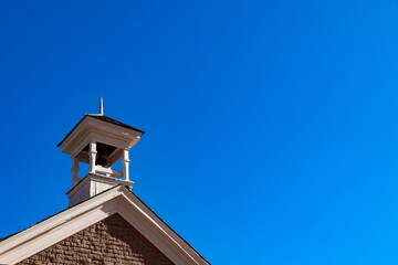 Low-angle shot of the dome of a public domain building in Ghost town with a man entering, Utah