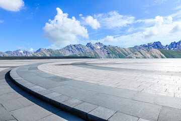 Empty square floor and mountain background