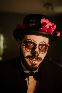 Young man wearing Day of the Dead costume