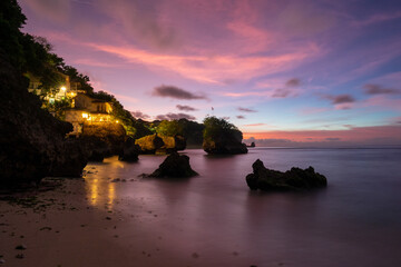 Sunset with beautiful pink and purple colors at Bingin beach, Bali, Indonesia