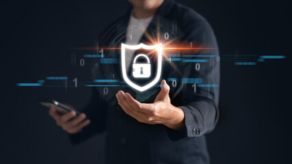 Man holding a lock icon symbolizing cyber security and protection against cyber threats.