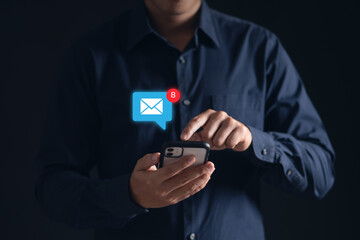 Stay connected with e-mail notifications! A man checks his inbox on his phone, keeping up with work...
