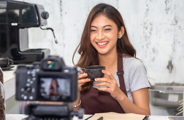 Fototapeta na wymiar Portrait of smiling beauty asian woman posing look at camera making live selfie, content, vlogger, blogger, live video streaming, broadcast, podcast, online influencer and creator on at cafe