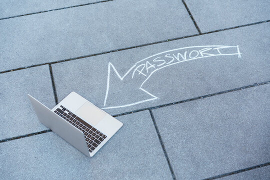 Laptop and password text arrow on road