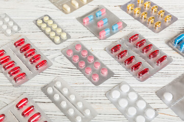 too many different pill of various blisters with different pills Medicines storage at home concept Medication storing. A pile of medicine in blister packs. Pharmaceutical blister packs
