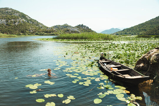 Woman swimming in Lake Skadar