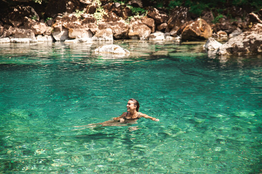 Young woman swimming in Tara river
