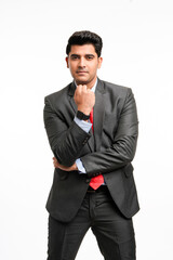 Young indian businessman in classic suit giving expression on white background.