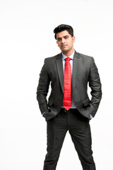 Young indian businessman in classic suit giving expression.