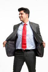 Young indian businessman in classic suit giving expression on white background.