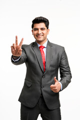 Young indian businessman showing thumps up