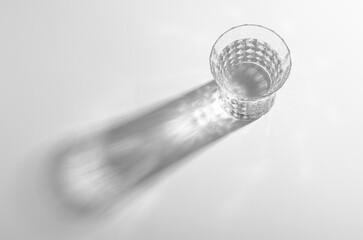 A Glass with Water and Sharp Shadows, Caustic Effect as Light Passes Through