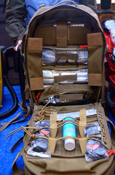 Backpack with soldier s first aid kit: bandages, wound-healing drugs, balloon with burn-treating gel, painkillers.