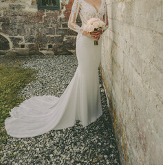 Elegant slim bride posing. - 588326158