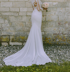 Elegant slim bride posing. - 588326162