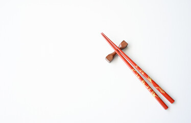Red Wooden chopsticks isolated on white