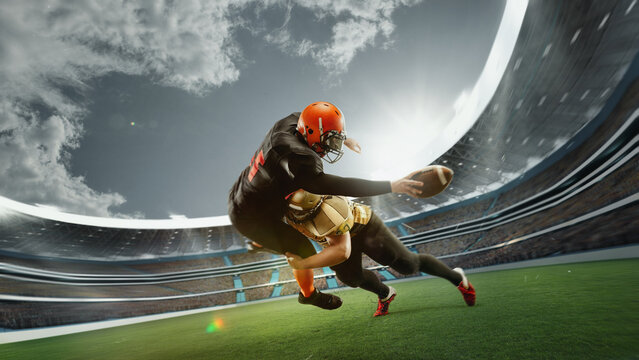Dynamic image of two men, professional american football players in motion during game at open air 3D stadium at daytime with blurred stands. Concept of sport, competition, action, game