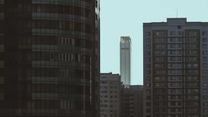 City skyscraper between normal buildings 