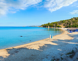 Morning sandy Kaviou beach. Summer top view (Nikiti, Sithonia, Halkidiki, Greece). People unrecognizable.